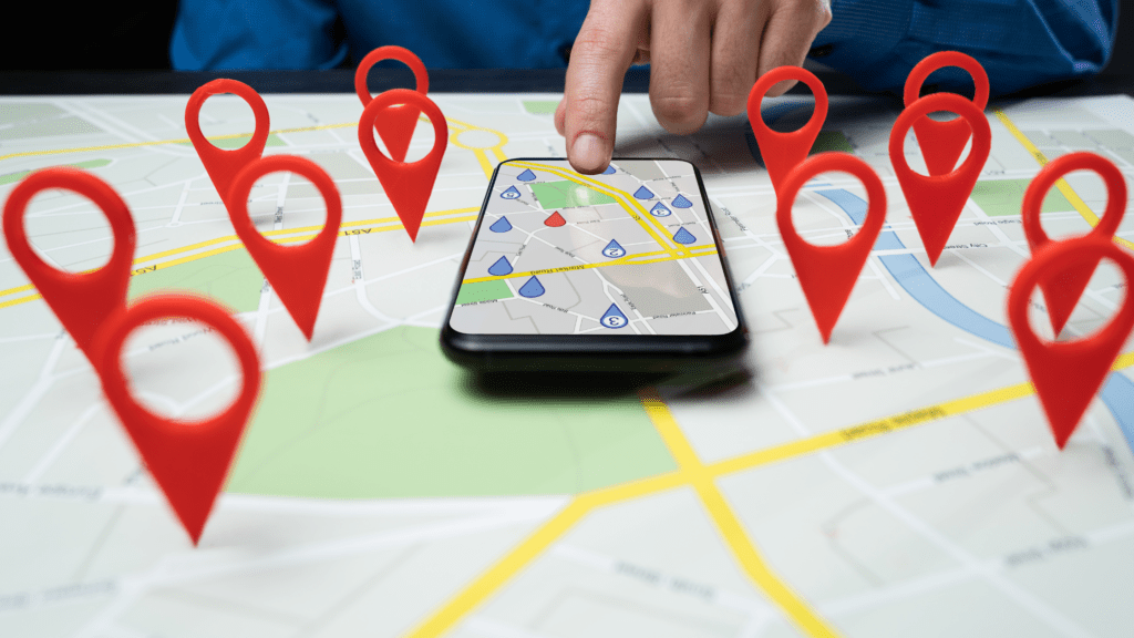 Image of a phone with Google map pins, showing local SEO for small businesses